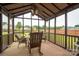Screened patio with a ceiling fan and furniture offers peaceful outdoor seating at 105 Carmel Hills Dr, Gastonia, NC 28056