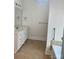 Bright bathroom with a white vanity featuring a marble countertop and a separate towel rack at 1108 Tarram Ct # 12, Lancaster, SC 29720