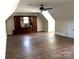 Large bonus room with light walls, dark floors, and an entertainment center against the wall at 1108 Tarram Ct # 12, Lancaster, SC 29720
