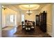 Bright dining room featuring hardwood floors, chandelier, and furniture set for hosting dinner parties at 1108 Tarram Ct # 12, Lancaster, SC 29720
