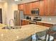 Modern kitchen with granite countertops, stainless steel appliances, and a functional island with seating at 1108 Tarram Ct # 12, Lancaster, SC 29720