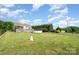 Expansive fenced backyard featuring a well-maintained lawn, in ground pool and a variety of mature trees at 115 Meadow Lake Dr, Salisbury, NC 28146