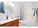 Bathroom with updated vanity, tile flooring, white shower and bathtub at 115 Meadow Lake Dr, Salisbury, NC 28146