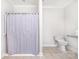 Neutral bathroom featuring a standing shower and toilet with accessibility bar at 115 Meadow Lake Dr, Salisbury, NC 28146