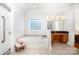 Bathroom featuring tiled floors, a soaking tub, and granite vanity at 115 Meadow Lake Dr, Salisbury, NC 28146