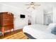 Bright bedroom features wood floors, ceiling fan, and classic furnishings at 115 Meadow Lake Dr, Salisbury, NC 28146