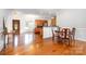 Home entryway features hardwood floors and transitions into kitchen and dining area at 115 Meadow Lake Dr, Salisbury, NC 28146