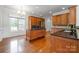 Charming kitchen with wood floors, cabinets and island, granite countertops and stainless steel appliances at 115 Meadow Lake Dr, Salisbury, NC 28146