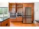A close view of the kitchen features stainless appliances, wood cabinets and granite countertops at 115 Meadow Lake Dr, Salisbury, NC 28146