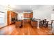 Spacious kitchen features wood floors, wood cabinets, stainless appliances, granite countertops and large center island at 115 Meadow Lake Dr, Salisbury, NC 28146
