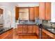 Open kitchen features stainless appliances, wood cabinets, and granite countertops at 115 Meadow Lake Dr, Salisbury, NC 28146