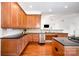 Bright kitchen features stainless dishwasher, wood cabinets, and granite countertops at 115 Meadow Lake Dr, Salisbury, NC 28146