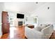 Well lit living room with fireplace, vaulted ceilings, and hardwood floors at 115 Meadow Lake Dr, Salisbury, NC 28146