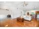 Living room with natural lighting, hardwood floors, and vaulted ceilings at 115 Meadow Lake Dr, Salisbury, NC 28146