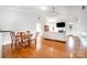 Open floor plan features hardwood floors and connects the living room to the kitchen and dining area at 115 Meadow Lake Dr, Salisbury, NC 28146