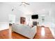 Bright living room includes fireplace, hardwood floors, vaulted ceilings and white wainscotting at 115 Meadow Lake Dr, Salisbury, NC 28146