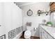 Well-lit bathroom with white shiplap walls, granite countertop, and rustic wood-look flooring at 120 Labans Ln, Lincolnton, NC 28092