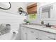 Beautifully renovated bathroom with shiplap accent wall, granite vanity and natural light window at 120 Labans Ln, Lincolnton, NC 28092