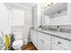 Bright bathroom featuring white cabinets, granite countertop and a shower/tub with white tiling at 120 Labans Ln, Lincolnton, NC 28092