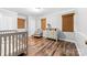 Cozy Bedroom featuring wood-look flooring, a comfortable chair, and natural woven shades at 120 Labans Ln, Lincolnton, NC 28092