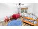 Bright and airy bedroom featuring colorful beds, hardwood floors and a ceiling fan at 120 Labans Ln, Lincolnton, NC 28092