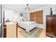 Comfortable bedroom featuring stylish decor, a plush bed, and a natural woven shade at 120 Labans Ln, Lincolnton, NC 28092