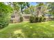 Back exterior featuring a stone patio, manicured landscaping and lush backyard at 120 Labans Ln, Lincolnton, NC 28092