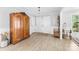 Welcoming foyer featuring wood-look flooring, neutral walls, decorative armoire, and entry to other rooms at 120 Labans Ln, Lincolnton, NC 28092