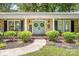 Charming brick home featuring a welcoming double door entry, well-manicured landscaping, and decorative wreaths at 120 Labans Ln, Lincolnton, NC 28092