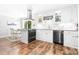 Modern kitchen featuring white cabinets, granite countertops, stainless steel appliances, and an island with seating at 120 Labans Ln, Lincolnton, NC 28092