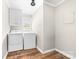 Functional laundry room with washer, dryer, cabinets and a bright window at 120 Labans Ln, Lincolnton, NC 28092