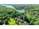 Stunning aerial view of a lakeside community surrounded by lush greenery and serene waters at 132 Parkside Ln, Mooresville, NC 28117