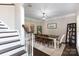Bright dining room featuring hardwood floors, a modern chandelier, and easy access to other living areas at 132 Parkside Ln, Mooresville, NC 28117