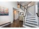Inviting foyer featuring a hardwood floor, elegant staircase, and stylish decor for a warm welcome at 132 Parkside Ln, Mooresville, NC 28117