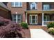 Charming brick home entrance with traditional design elements and well-maintained landscaping at 132 Parkside Ln, Mooresville, NC 28117