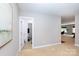 Bright hallway with a view of a bathroom and living room, creating an open and airy feel at 132 Parkside Ln, Mooresville, NC 28117