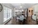Bright kitchen with white cabinets, stainless steel appliances, island, hardwood floors, and a dining area at 132 Parkside Ln, Mooresville, NC 28117