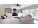 Cozy and elegant living room with plush seating, a decorative fireplace, and an abundance of natural light at 132 Parkside Ln, Mooresville, NC 28117