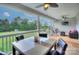 Relaxing back porch with ceiling fans, comfortable seating, and a beautiful outdoor view at 1327 Springlake Rd, York, SC 29745