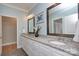 Stylish bathroom with double vanities, granite countertops, framed mirrors, and a separate doorway at 1327 Springlake Rd, York, SC 29745