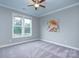 Comfortable bedroom with carpet, a window, and art on the wall at 1327 Springlake Rd, York, SC 29745
