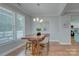 Charming dining room with a large window and stylish chandelier is perfect for Gathering meals at 1327 Springlake Rd, York, SC 29745