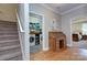 Hallway featuring a stairway, desk, laundry room, and doorway to a bedroom at 1327 Springlake Rd, York, SC 29745