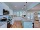 Spacious kitchen with stainless steel appliances, a granite island, and pendant lighting at 1327 Springlake Rd, York, SC 29745
