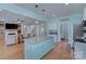 Open-concept kitchen with granite island, seamlessly connecting to the living room at 1327 Springlake Rd, York, SC 29745