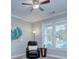 Relaxing living room with a ceiling fan, recliner, side table, and sun-lit windows with views at 1327 Springlake Rd, York, SC 29745