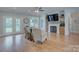 Bright living room with fireplace, built-ins, and access to the back porch is perfect for relaxing at 1327 Springlake Rd, York, SC 29745