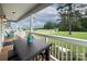 Enjoy outdoor living on this covered front porch with comfortable seating and a peaceful neighborhood view at 1327 Springlake Rd, York, SC 29745