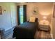 Cozy bedroom with a single bed, ample natural light, and a modern nightstand at 150 Wordsworth Way, Mooresville, NC 28115