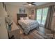 Comfortable bedroom with a ceiling fan and large window for natural light at 150 Wordsworth Way, Mooresville, NC 28115